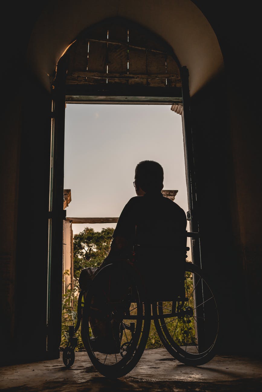 man sits on wheelchair